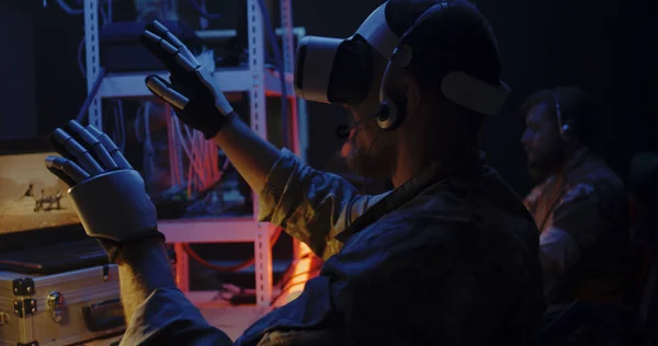 Soldier using VR headset and gloves