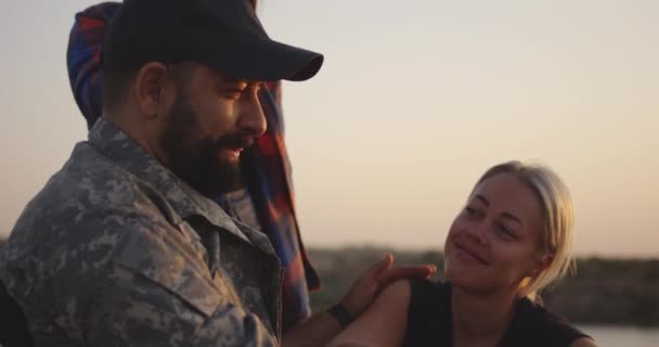 Wheelchaired soldier hugging his daughter — Stock Video
