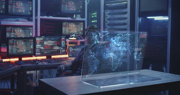 Hacker watching holographic display screens — Stock Photo, Image