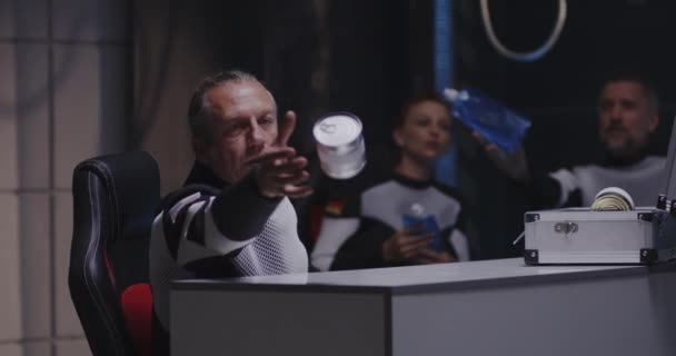 Astronaut catching tin can in zero gravity — Stock Video