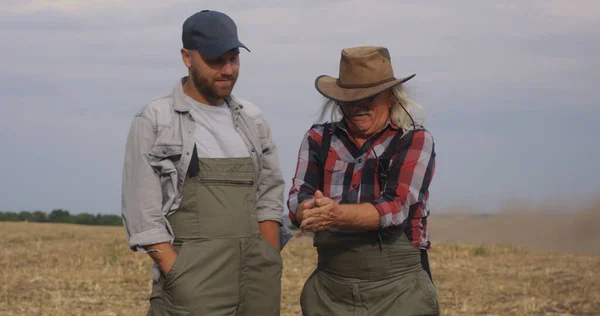 Positive farmers dispersing soil in air