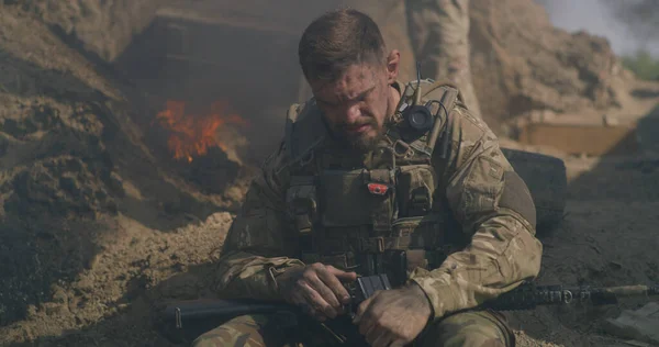 Male soldier resting during war — Stock Photo, Image