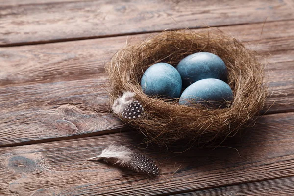 Three Marble Blue Easter Eggs Nest Feathers Wooden Background Eggs — Stock Photo, Image