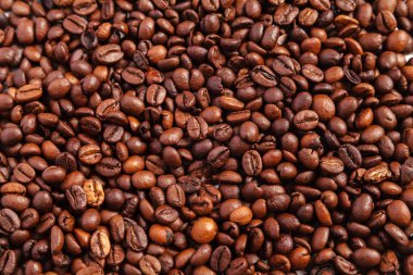 kavrulmuş kahve çekirdeği arka plan doku. kahve - sıcak içecek madde kavurma Arapça. arka plan ve doku kahverengi kahve çekirdekleri.