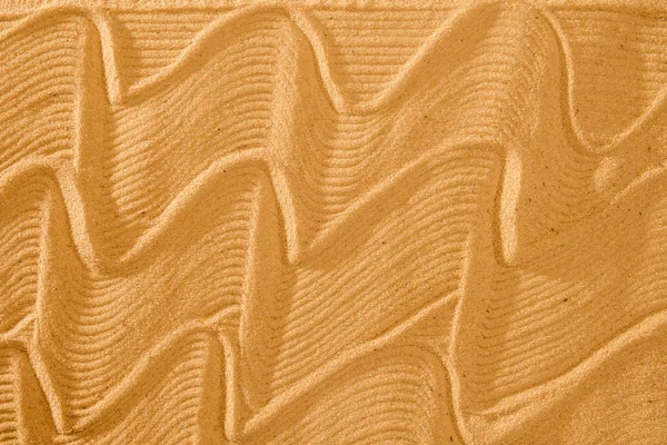 流れる波のパターンと健康とコピー領域と静けさのため砂で同心円起伏のあるアート — ストック写真