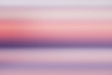 Huzurlu bulanıklık degrade güzel mor okyanus pembe gökyüzü günbatımı arka plan ile.