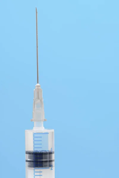 White Syringe Closeup Isolated Blue Background — Stock Photo, Image