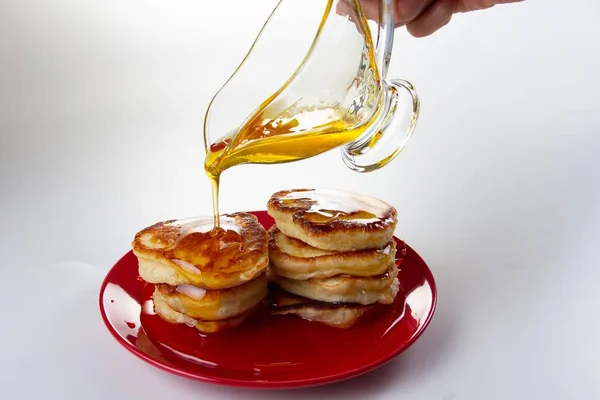 Honey syrup on pancake, delicious dessert food on white,  breakfast. — Stock Photo, Image