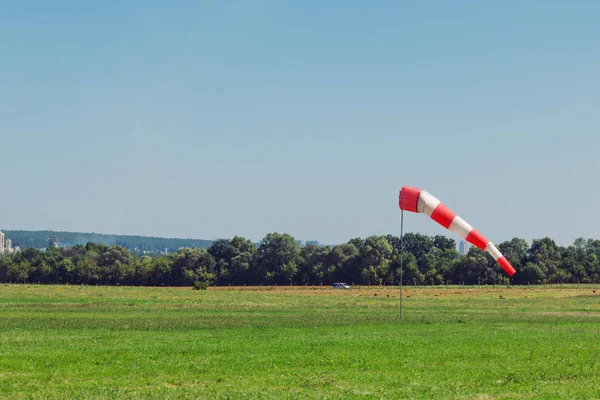 Windsock as a gauge for winds, wind vane on aerodrome airfield on an air show — Stock Photo, Image