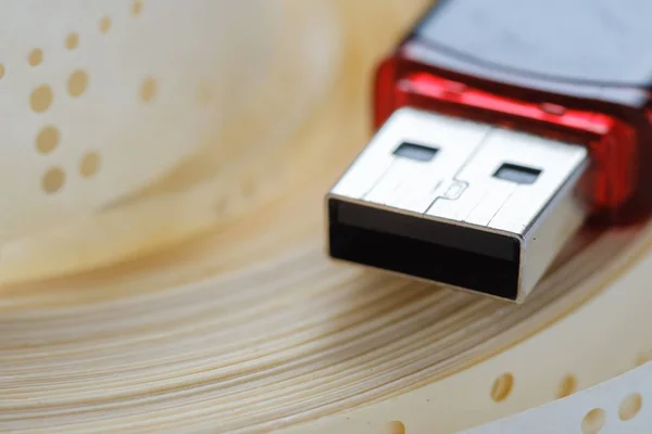 Usb flash drive and obsolete punched tape,  data.