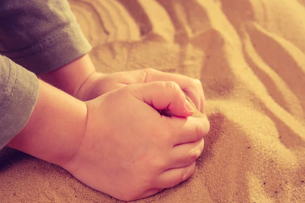 Sand therapy, child's hands are painted on table with sand — Stock Photo, Image