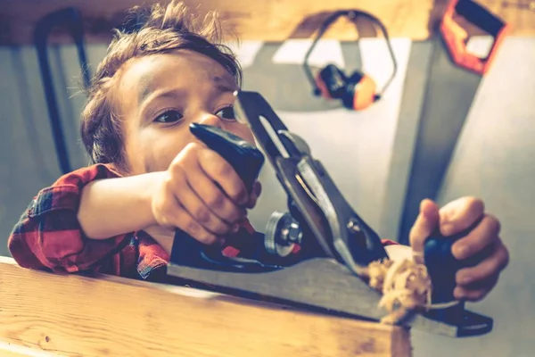 Child fathers day concept, carpenter tool,  workshop.