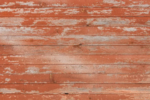 带有剥落裂缝红色油漆的旧木板的背景 — 图库照片