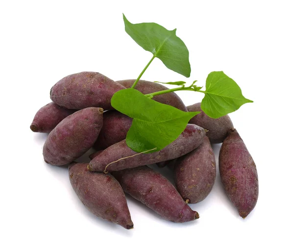 Fresh purple sweet potato with leaf isolated on the white background