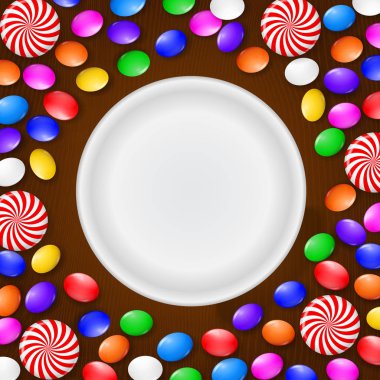 Renkli şeker, tatlılar ve lolipop. Kahverengi ahşap zemin üzerinde. Yukarıdan görüntülemek.