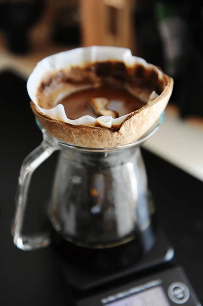 Unusual creative coconut shell pourover drip alternative coffee brewing on timer scale — Stock Photo, Image