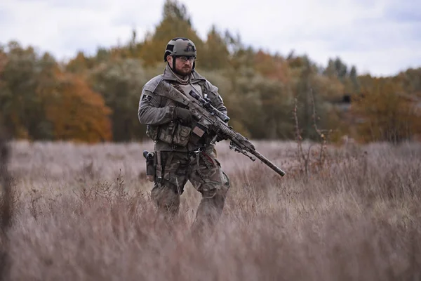 Sniper reload his rifle in forest Stock Photo by ©Nesterenko_Max 89103288