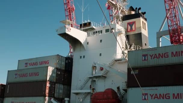 Odessa, Ukraine, October 20, 2018. The left side of the merchant ship loaded with containers. On board the vessel is a lifeboat gated. — Stock Video