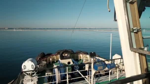 View of the front bow part of the towing vessel sailing into the sea on a bright sunny day. Ship towing — Stock Video
