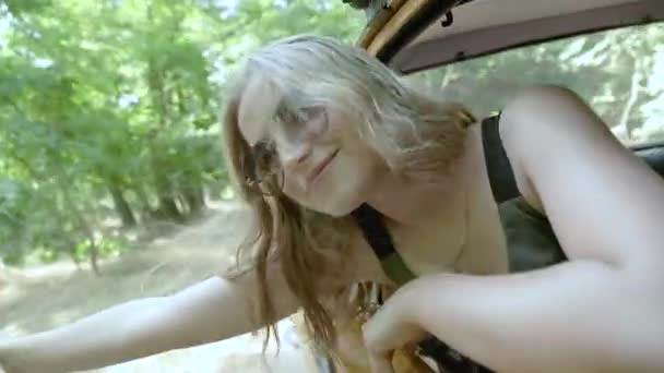 Happy Young Woman Leans Out Car Window — Stock Video