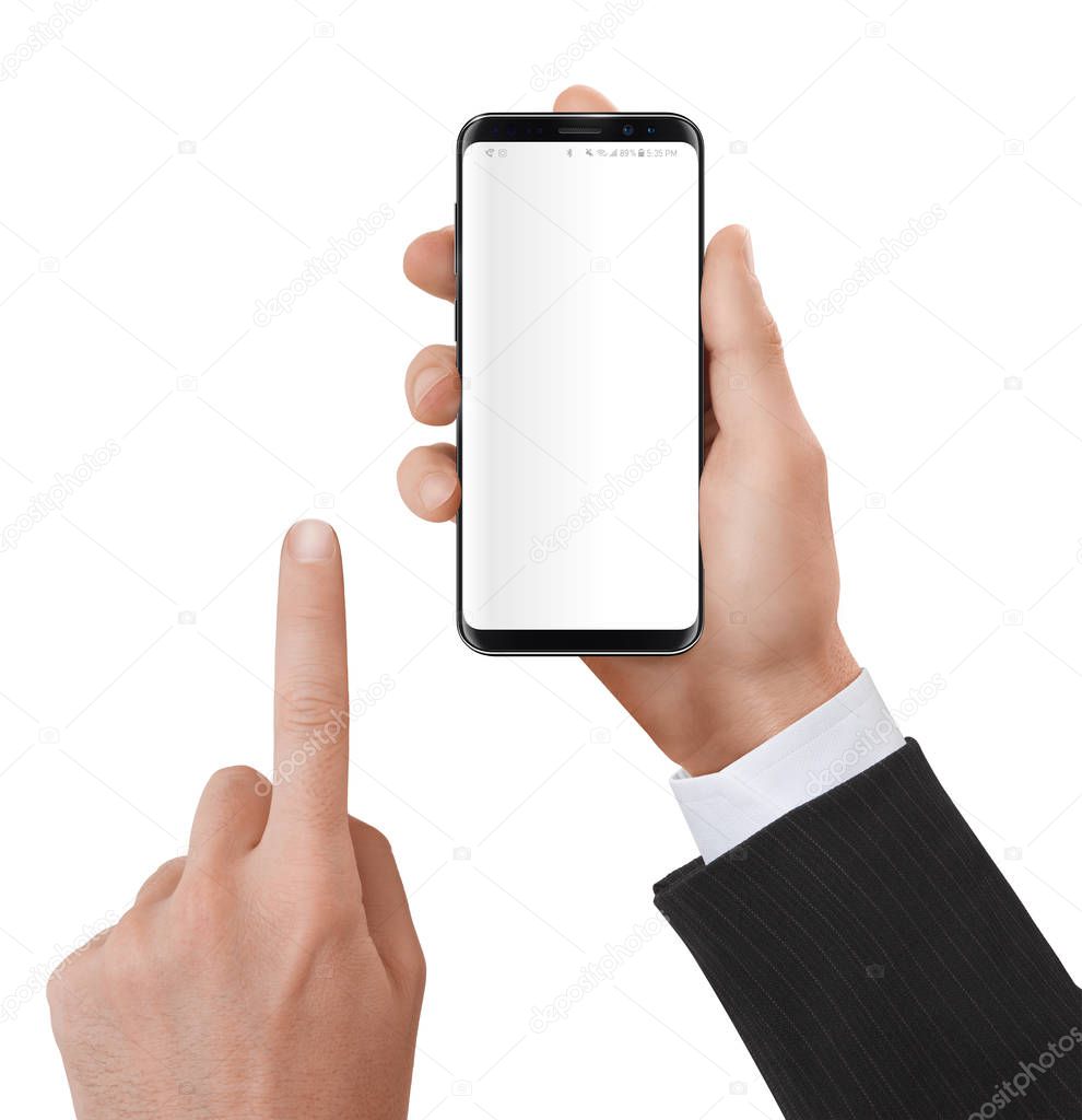 Elegant dressed man holding a smartphone in his hands with neutral white screen.