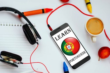 smartphone with portuguese flag and headphones. concept of portuguese learning through audio courses clipart