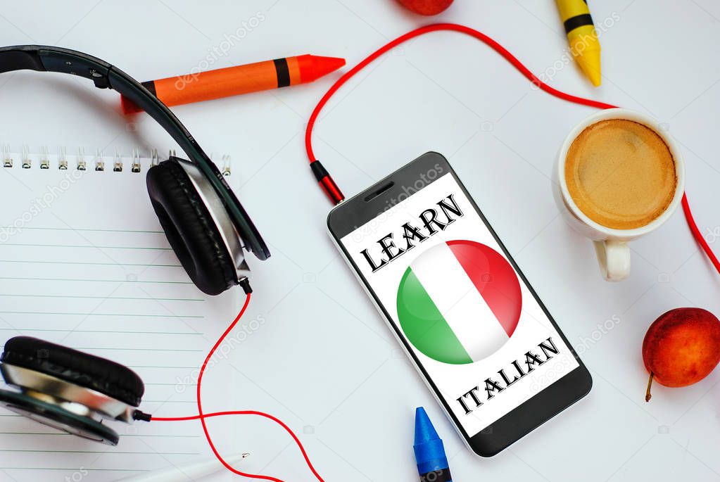 smartphone with Italian flag and headphones. concept of italian learning through audio courses