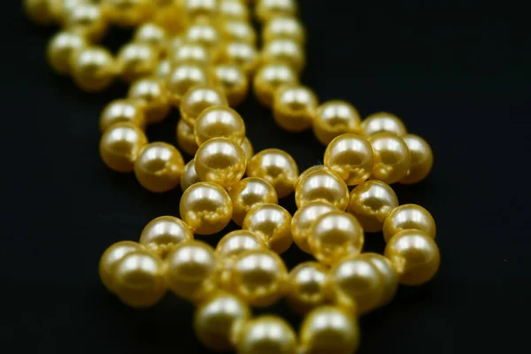 Pearls with black background. Tilt-shift effect applied.