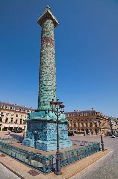 Paris, France-MAY 06, 2018: Vendome column and beautiful buildings in background on Vendome square. Famous touristic place and travel destination in Europe.