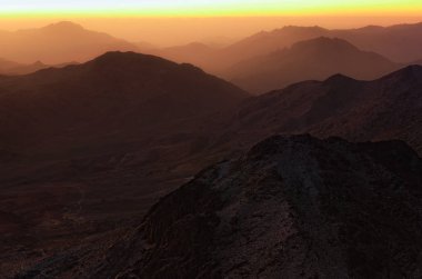 Picturesque view of Mount Sinai (Mount Horeb, Gabal Musa, Moses Mount) during sunrise. Sinai Peninsula of Egypt. Pilgrimage place and famous touristic destination. clipart