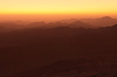Panoramic landscape view of Mount Sinai (Mount Horeb, Gabal Musa, Moses Mount) during sunrise. Sinai Peninsula of Egypt. Pilgrimage place and famous touristic destination. clipart