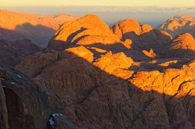 Scenic landscape of mountain peaks during sunrise. Sinai Mountain (Mount Horeb, Gabal Musa, Moses Mount). Sinai Peninsula of Egypt. Pilgrimage place and famous touristic destination. clipart