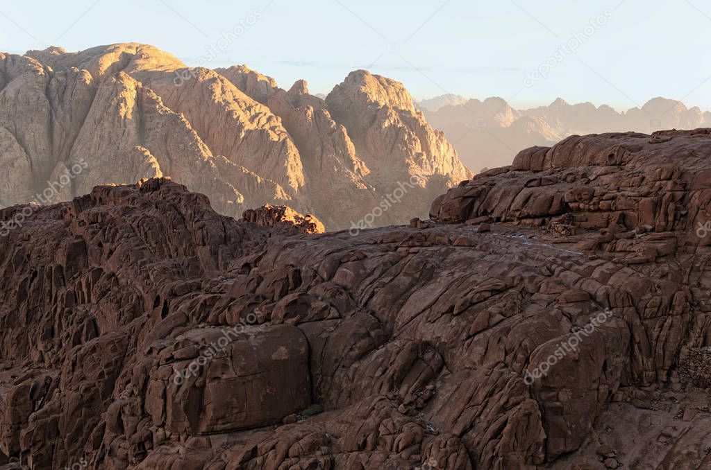 Stunning landscape of rocky peaks against a blue sky. Mount Sinai (Mount Horeb, Gabal Musa). Sinai Peninsula of Egypt. Famous touristic place and travel destination in Egypt.