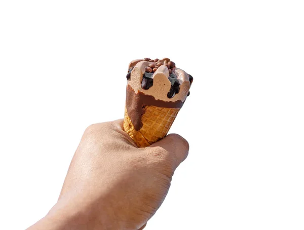 Hand with ice cream on blurred blue sky isolated — Stock Photo, Image