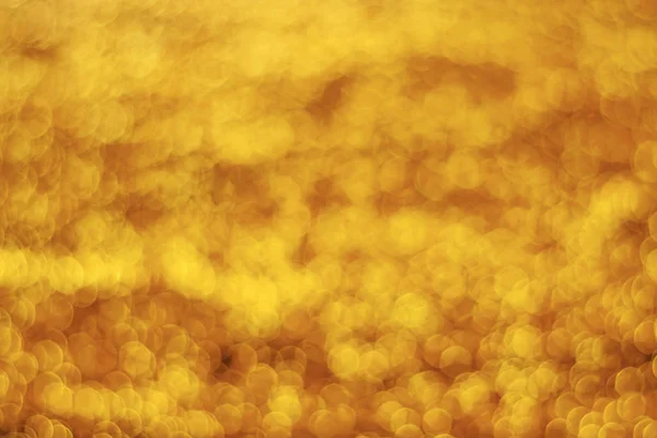 Abstract gold light bokeh christmas light blurred background