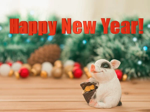 Ceramic pig with money box on Christmas ornaments and lights background, selective focus. New year backdrop with 3d inscription \