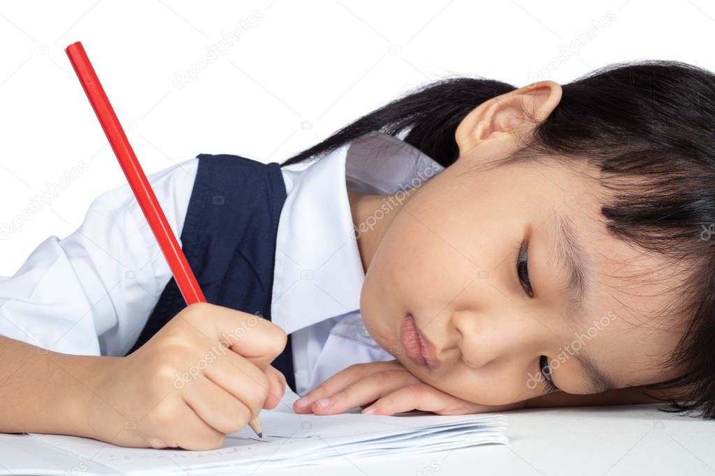 Asian Chinese little girl wearing school uniform studying in isolated white background