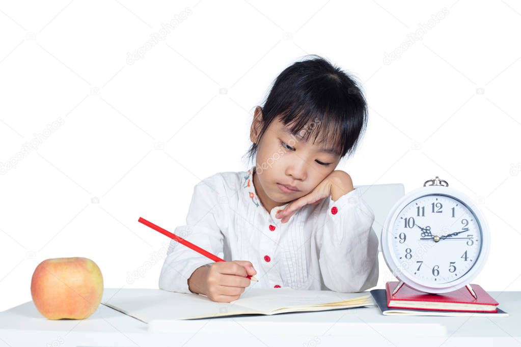 Asian Chinese Little Girl doing homework in isolated white background