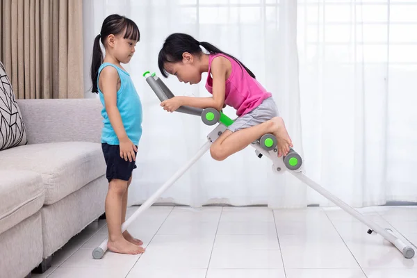 Asian Chinese Little Sisters Playing Workout Machine Living Room Home — Stock Photo, Image