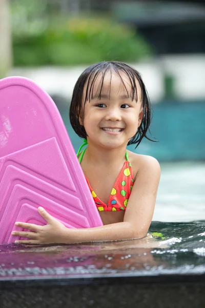 Asian Little Chinese Girl playing at water park — Stock Photo, Image