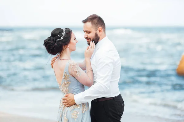 Same couple with a bride in a blue dress walk — Stock Photo, Image