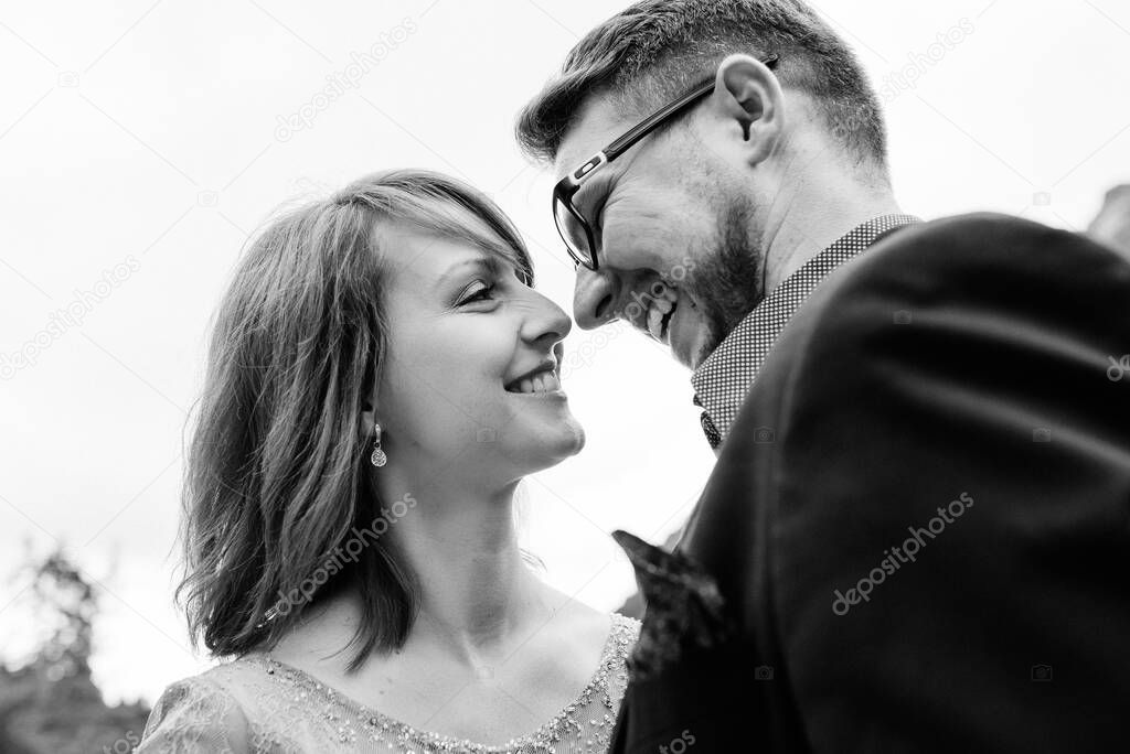 Young couple on a walk near the lake surrounded by the Carpathian mountains