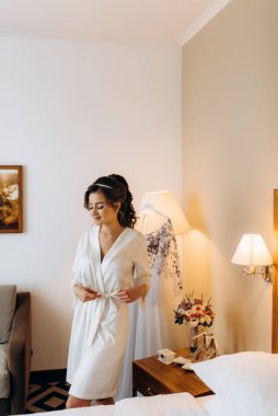 morning of the bride with the creation of the image of makeup and the creation of hairstyles