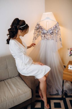 morning of the bride with the creation of the image of makeup and the creation of hairstyles