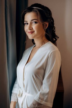 morning of the bride with the creation of the image of makeup and the creation of hairstyles