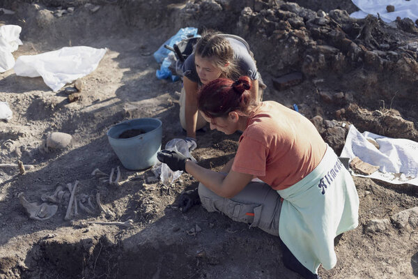 Vinca, Serbia, Sep 27, 2019: Two young women archeologist working on archeological excavations