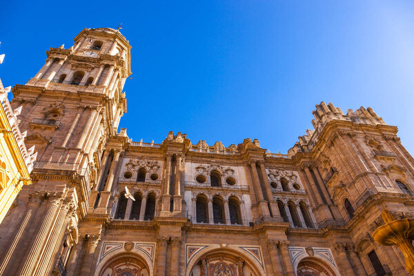 Facade and bell tower of the Cathedral of the Incarnation in Malaga, Spain