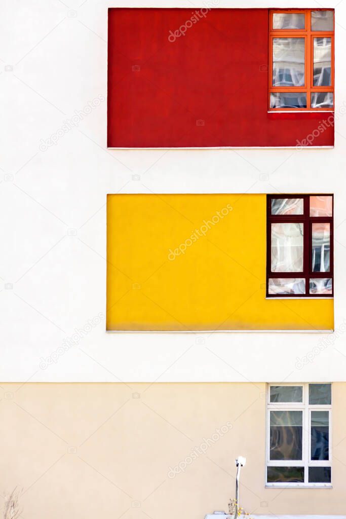 House building exterior wall with three color windows