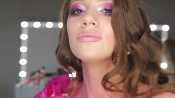 Charming young woman with pink make-up — Stock Video