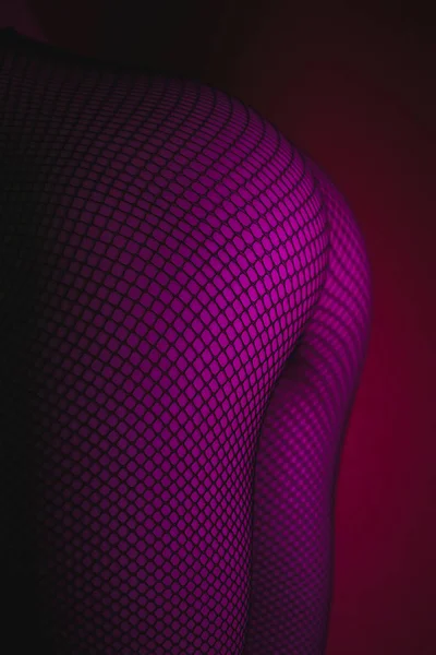 Sensual naked woman in tights in neon — Stock Photo, Image